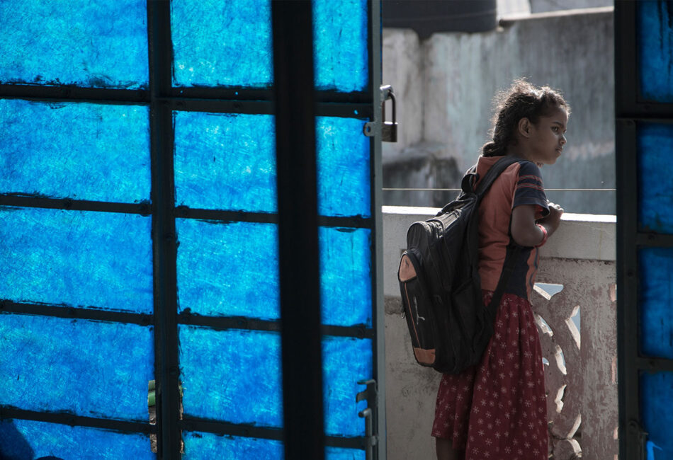 Young girl with school bag