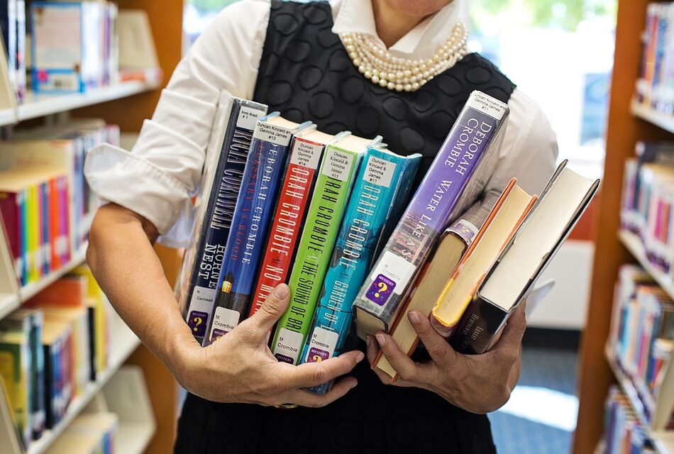 A person holding a set of books